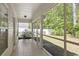 Inviting screened-in porch offering views of the fenced backyard at 680 Twinflower St., Little River, SC 29566