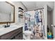 Bathroom with a dark vanity, white countertop, and a llama-themed shower curtain at 6864 Woodhaven Dr., Myrtle Beach, SC 29588
