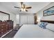 Bright bedroom with neutral walls, wood-look flooring, and a large window at 6864 Woodhaven Dr., Myrtle Beach, SC 29588