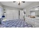 Bright bedroom features wood floors, a ceiling fan, and plenty of closet space at 6864 Woodhaven Dr., Myrtle Beach, SC 29588