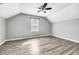 Bright bedroom with wood-look floors, a large window, and plenty of natural light at 6864 Woodhaven Dr., Myrtle Beach, SC 29588