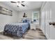 Charming bedroom with seaside accents, hardwood floors, and bright natural light at 6864 Woodhaven Dr., Myrtle Beach, SC 29588