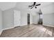 Bright bedroom features wood-look floors, neutral walls, and ceiling fan at 6864 Woodhaven Dr., Myrtle Beach, SC 29588