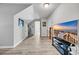 Bonus room with wood-look flooring, neutral walls, and a large television at 6864 Woodhaven Dr., Myrtle Beach, SC 29588
