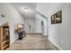 Bonus room featuring wood-look flooring, neutral walls, and a large TV at 6864 Woodhaven Dr., Myrtle Beach, SC 29588