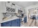 This modern kitchen has new stainless steel appliances, a wine rack, and sleek countertops at 6864 Woodhaven Dr., Myrtle Beach, SC 29588