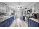 Updated kitchen with stainless steel appliances, modern countertops, updated cabinets and a tile backsplash at 6864 Woodhaven Dr., Myrtle Beach, SC 29588