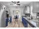 A modern kitchen view into the dining room with stainless steel appliances and updated cabinets at 6864 Woodhaven Dr., Myrtle Beach, SC 29588