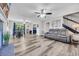Bright and airy living space with fireplace, dining area, and staircase leading to the upper level at 6864 Woodhaven Dr., Myrtle Beach, SC 29588