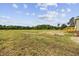 Large backyard featuring a lawn, a wooden deck, and trees surrounding the perimeter at 7019 Norton Rd., Green Sea, SC 29545
