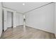 A bright bedroom with light-colored walls, trim, and closet with a light wood-look flooring at 7019 Norton Rd., Green Sea, SC 29545