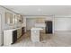 Well-equipped kitchen features wooden cabinets, a center island, and modern appliances, open to dining space at 7019 Norton Rd., Green Sea, SC 29545