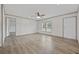 Bright living room features wood-look flooring and a ceiling fan at 7019 Norton Rd., Green Sea, SC 29545