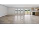 Spacious living room features large windows, sliding glass doors to the outside deck, and an adjacent kitchen area at 7019 Norton Rd., Green Sea, SC 29545