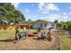 Backyard fire pit surrounded by Adirondack chairs creates a cozy gathering space with well-maintained landscaping at 709 Yucca Ave., Myrtle Beach, SC 29577