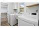 Efficient laundry room with modern washer and dryer, utility sink, and natural light from a bright window at 709 Yucca Ave., Myrtle Beach, SC 29577