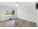 Bedroom with white ceiling fan and nice flooring; flooded with natural light from the large windows at 709 Yucca Ave., Myrtle Beach, SC 29577