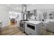 Well-equipped kitchen with stainless appliances, gray cabinets, and an island with built in microwave at 709 Yucca Ave., Myrtle Beach, SC 29577