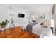 Well-lit bedroom with a view of the bathroom, dining room, and a decorative dresser at 709 Yucca Ave., Myrtle Beach, SC 29577