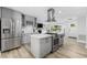 Modern kitchen with gray cabinetry, stainless steel appliances, and a center island with a gas cooktop at 709 Yucca Ave., Myrtle Beach, SC 29577