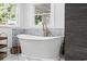 Luxurious bathroom with a standalone soaking tub and natural light at 709 Yucca Ave., Myrtle Beach, SC 29577