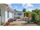 Spacious backyard patio features an outdoor kitchen, dining area, and comfortable lounge seating, ideal for gatherings at 709 Yucca Ave., Myrtle Beach, SC 29577