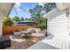 Charming patio features a built-in grill, dining set, and lush landscaping, perfect for outdoor entertaining at 709 Yucca Ave., Myrtle Beach, SC 29577