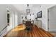 Sunlit dining room with hardwood floors, sliding glass doors, barn door and modern light fixture at 709 Yucca Ave., Myrtle Beach, SC 29577