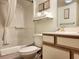 Clean bathroom featuring a toilet, tub, and a vanity with decorative touches at 7100 N Ocean Blvd. # 621, Myrtle Beach, SC 29572