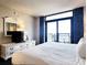 Cozy bedroom featuring a comfortable bed, a sliding glass door and private balcony access at 7100 N Ocean Blvd. # 621, Myrtle Beach, SC 29572