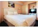 Comfortable bedroom featuring a bed, TV, and soft lighting at 7100 N Ocean Blvd. # 621, Myrtle Beach, SC 29572