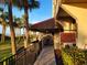 Charming outdoor cafe with seating, palm trees, and scenic ocean views at 7100 N Ocean Blvd. # 621, Myrtle Beach, SC 29572
