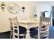 Dining room with a light wood table and chairs and decor on the wall at 7100 N Ocean Blvd. # 621, Myrtle Beach, SC 29572