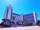 Oceanfront hotel featuring a modern design, multiple floors, and a blue and white color scheme at 7100 N Ocean Blvd. # 621, Myrtle Beach, SC 29572