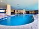 Indoor pool area with seating and a lifeguard stand at 7100 N Ocean Blvd. # 621, Myrtle Beach, SC 29572