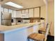 Well-equipped kitchen with stainless steel appliances, breakfast bar, and ample counter space at 7100 N Ocean Blvd. # 621, Myrtle Beach, SC 29572