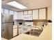 Well-equipped kitchen with stainless steel appliances and white cabinetry at 7100 N Ocean Blvd. # 621, Myrtle Beach, SC 29572