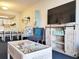 Bright and airy living room with unique decor, comfortable seating, and an entertainment center at 7100 N Ocean Blvd. # 621, Myrtle Beach, SC 29572
