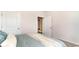 Neutral bedroom featuring a comfortable bed and view of an ensuite doorway at 7399 Meadow Walk Loop, Loris, SC 29569