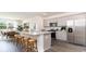 Open kitchen design boasting stainless appliances, granite counters, breakfast bar, and hardwood floors at 7399 Meadow Walk Loop, Loris, SC 29569