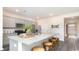 Modern kitchen with a large island, stainless steel appliances, granite countertops, and ample cabinet space at 7399 Meadow Walk Loop, Loris, SC 29569