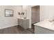 Bathroom featuring double sinks, a spacious vanity, and a walk-in closet entrance at 7415 Meadow Walk Loop, Loris, SC 29569