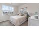 Bedroom highlights a large window, a plush bed, and side tables with lamps at 7415 Meadow Walk Loop, Loris, SC 29569