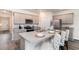 Stylish kitchen features granite countertops, stainless steel appliances, and breakfast bar with seating for three at 7415 Meadow Walk Loop, Loris, SC 29569