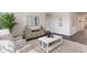 Bright living room features stylish decor, modern furnishings, and neutral color palette at 7415 Meadow Walk Loop, Loris, SC 29569