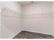 Empty walk-in closet with white wire shelving and wood flooring, ready for organization at 7415 Meadow Walk Loop, Loris, SC 29569