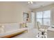 Bright bedroom or office space featuring a futon, built in desk, and ample natural light from the window at 78 Saltwind Loop, Murrells Inlet, SC 29576