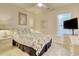 Comfortable bedroom featuring a patterned comforter, soft carpet, and modern decor at 78 Saltwind Loop, Murrells Inlet, SC 29576