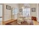 Charming dining room with a chandelier and classic decor with light walls and hardwood floors at 78 Saltwind Loop, Murrells Inlet, SC 29576