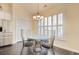 Bright dining area with a round glass table, modern chairs, and ample natural light at 78 Saltwind Loop, Murrells Inlet, SC 29576